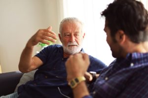 senior man talking to son about what not to say to a senior
