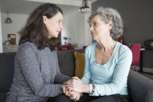 mother talking to senior mother about needing memory care