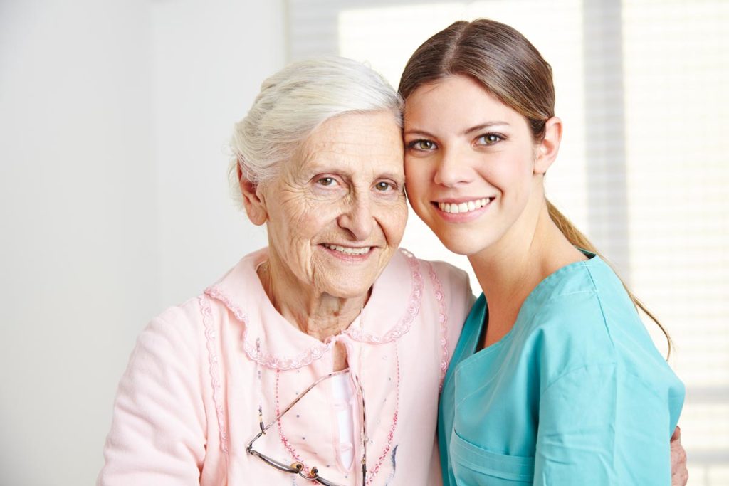 senior woman with adult woman learning coping strategies for caregivers