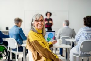 smiling woman in educational programs for seniors