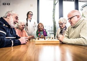 group of seniors playing chess