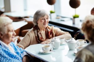 senior women drinking coffee onsenior group outings