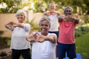 woman doing yoga which is the best exercises for seniors