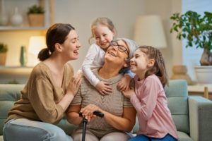 Daughter and her kids laughing with grandma are the type of activities to do with grandkids