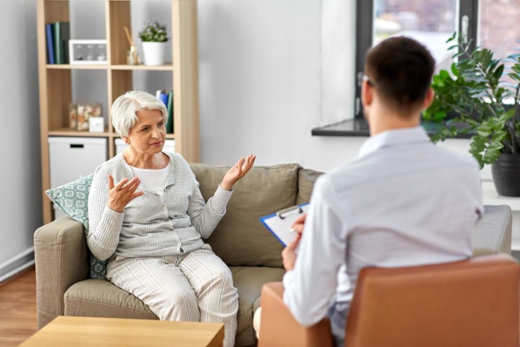 a therapist discusses benefits of occupational therapy for seniors with a senior patient