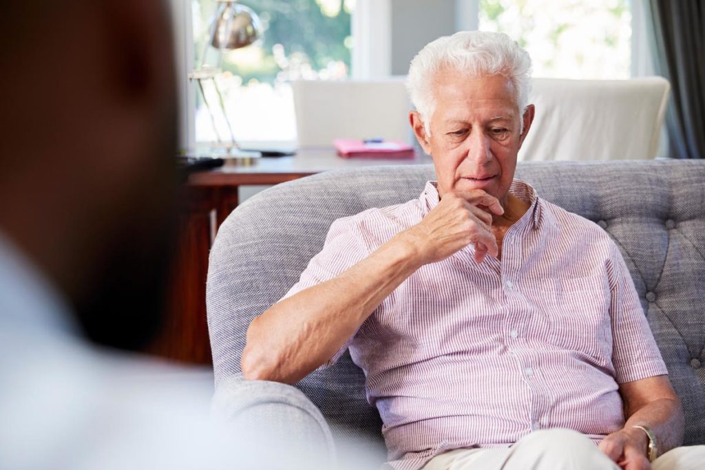 a senior talks to a therapist about depression in seniors