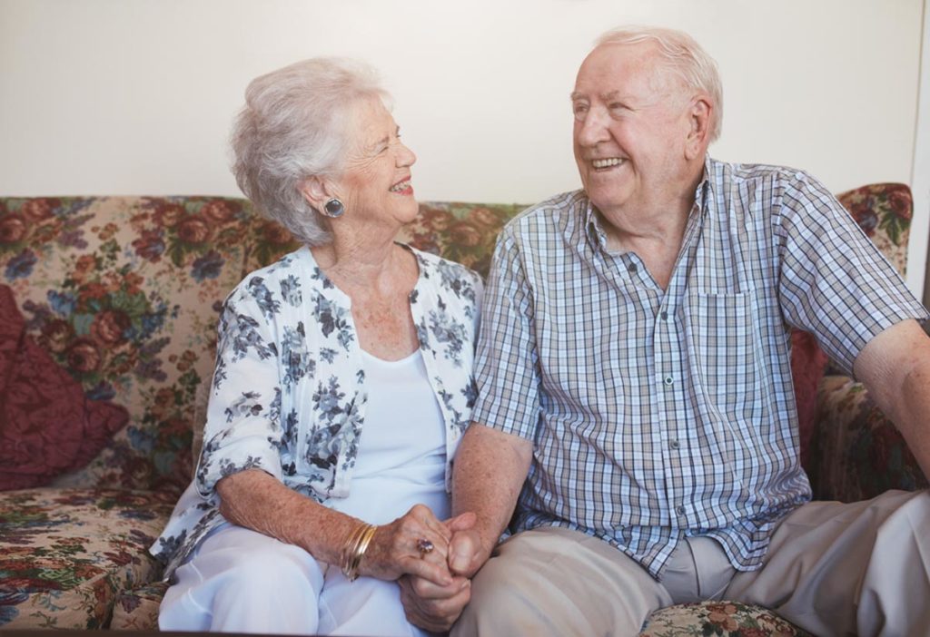 two seniors laugh in a retirement home in Dallas, Texas