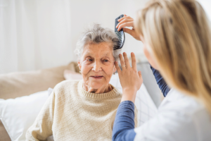 a nurse checks on a senior after asking what is respite care