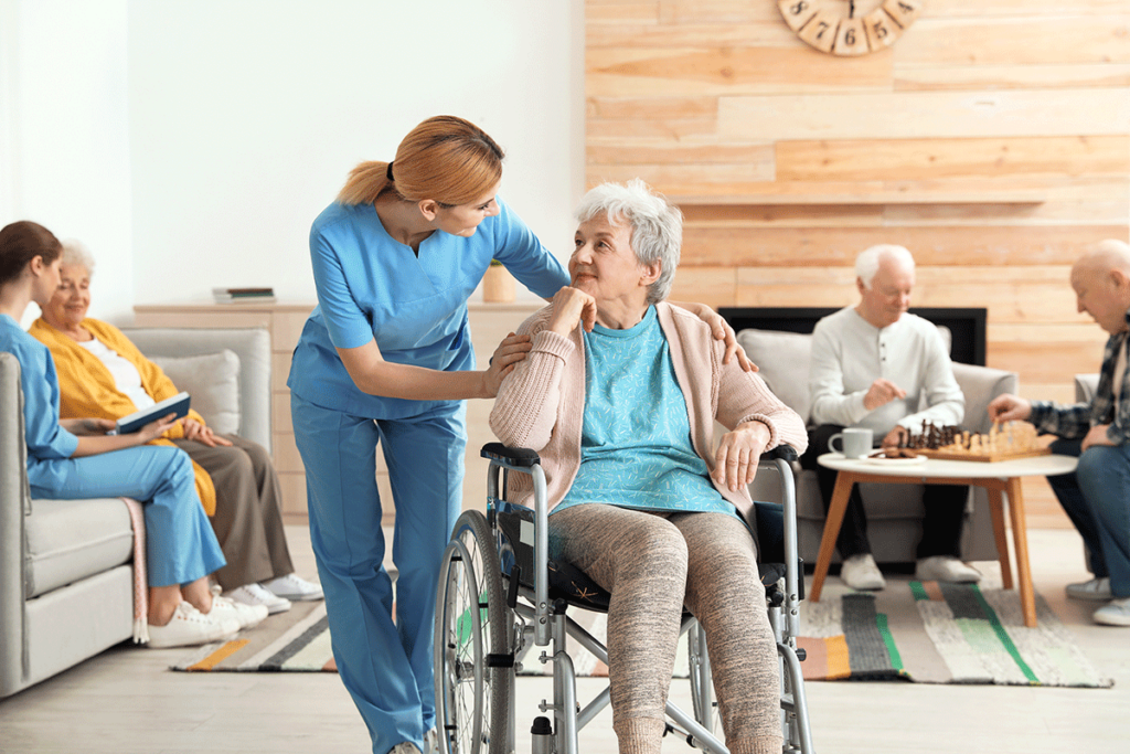 a nurse in a continuing care retirement community helps a resident in a wheelchair