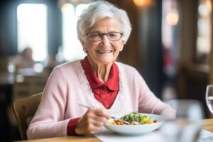 a senior eats a nutritious meal, one of the benefits of assisted living