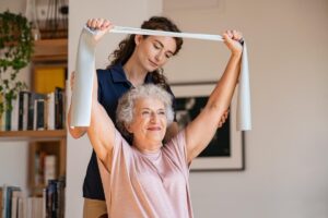 A woman enjoys physical therapy for seniors.