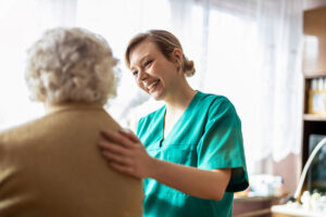 a nurse talks with a patient about taking a senior to the doctor
