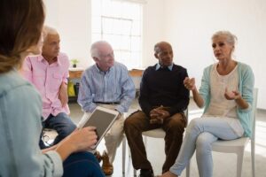 a group discusses Safety in Senior Living Services