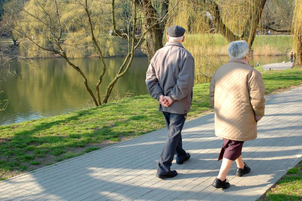 two seniors go for a walk, enjoying the freedom of independent living