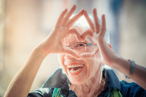 A senior adult woman loves the healthy lifestyle she has through the exercise program in senior living.